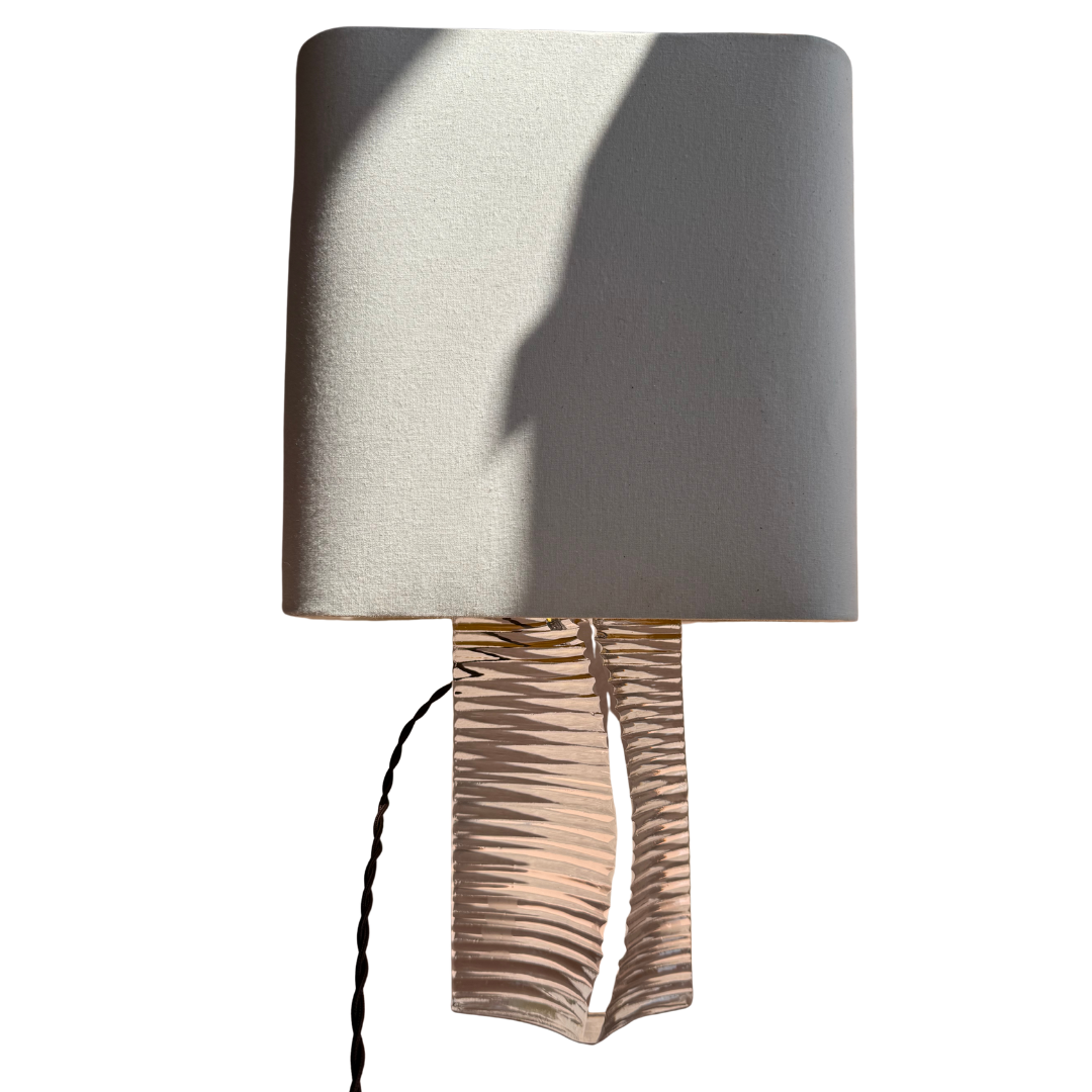 Neutral linen lampshade paired with signed Daum France crystal base.