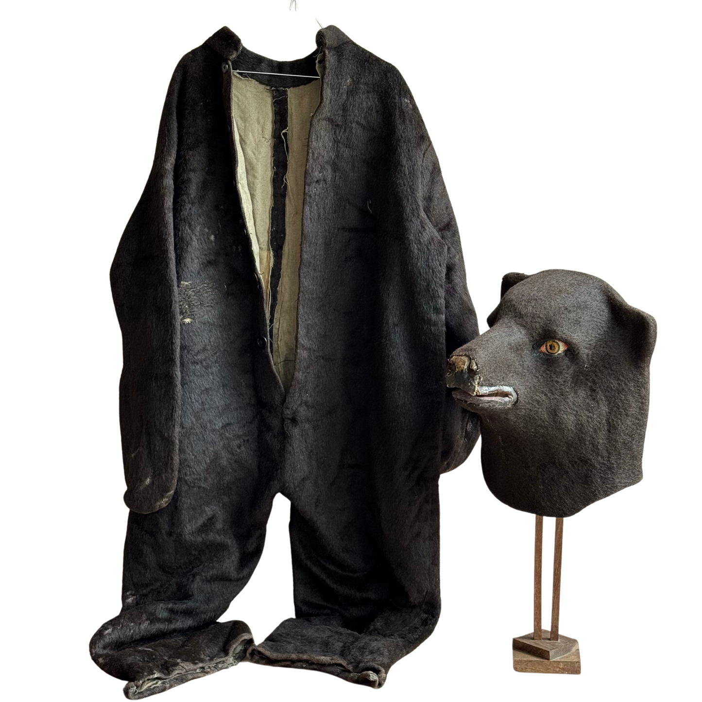 Front view of full-body brown wool-felt bear suit hanging open to show lining and button closures.