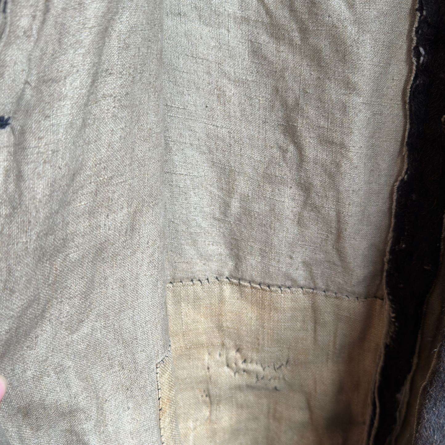 Interior of bear suit showing original cotton lining and hand-stitched seams.