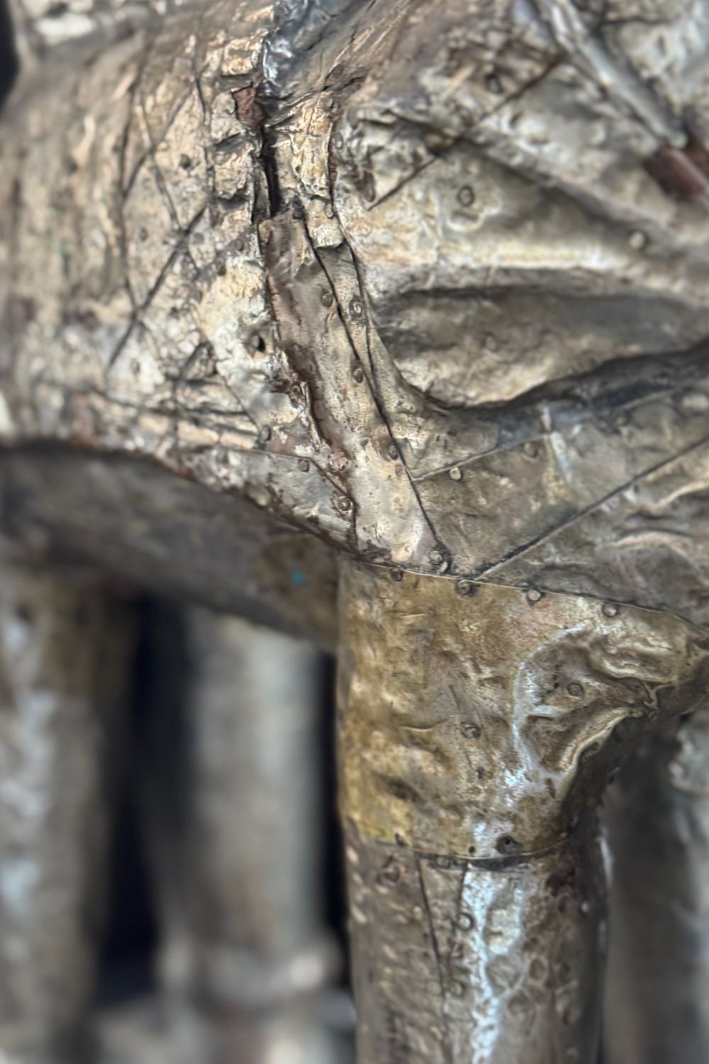 Top-down view of the sculpture’s hollow saddle opening, revealing the interior wooden structure.