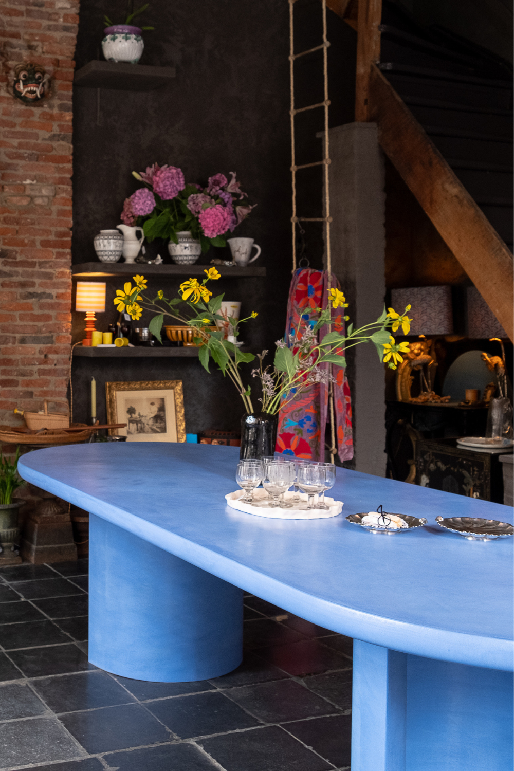 Custom blue microcement table by Correl (Wim Coucke) and Maaike Selects. Handmade, minimalist, and available in bespoke colors.