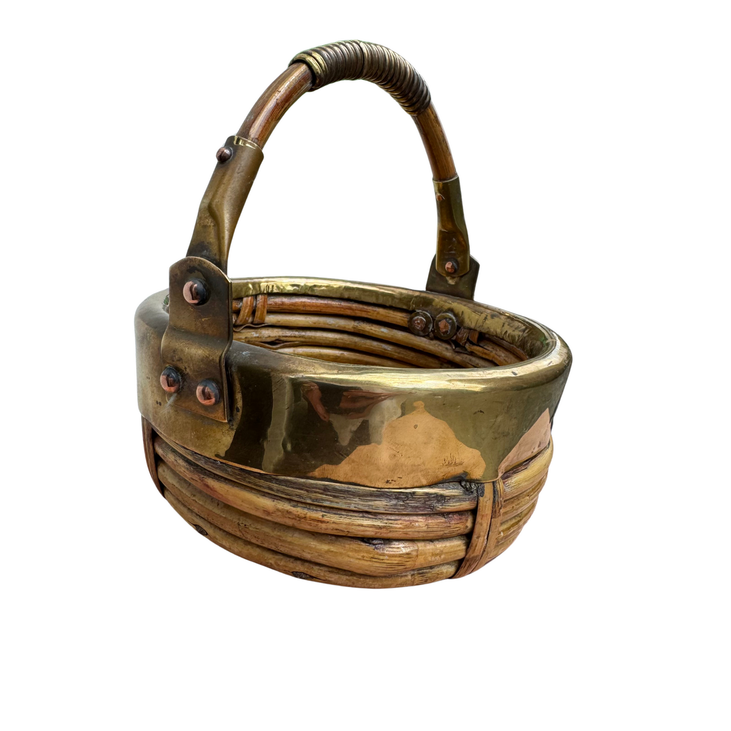 Top-down view of round rattan basket interior and brass rim