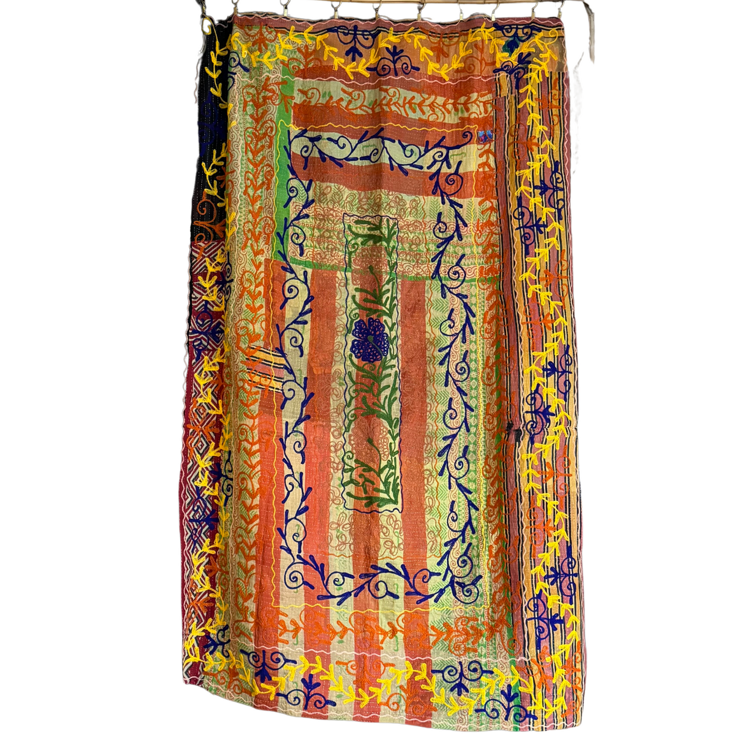 Full view of hand-embroidered kantha in orange, green, and blue with floral motifs