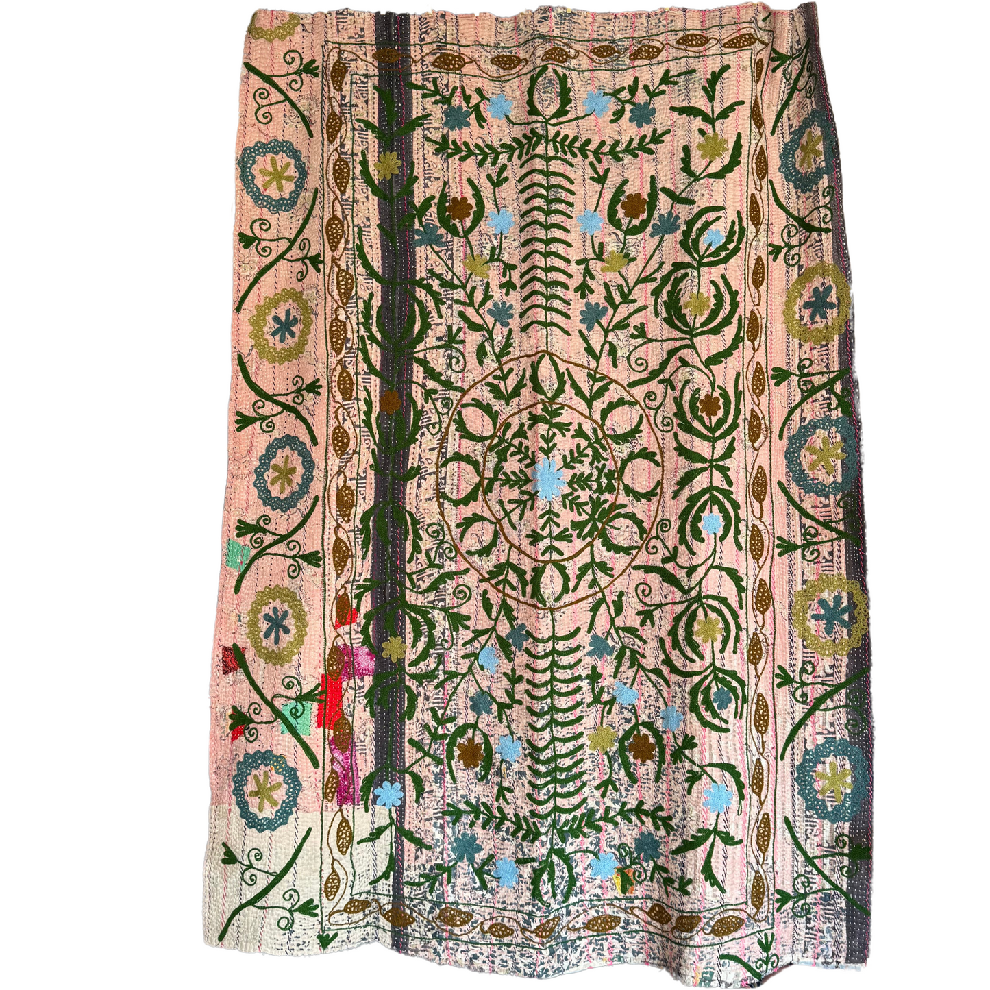 Full view of kantha quilt with botanical embroidery in green and blue on soft pink cotton