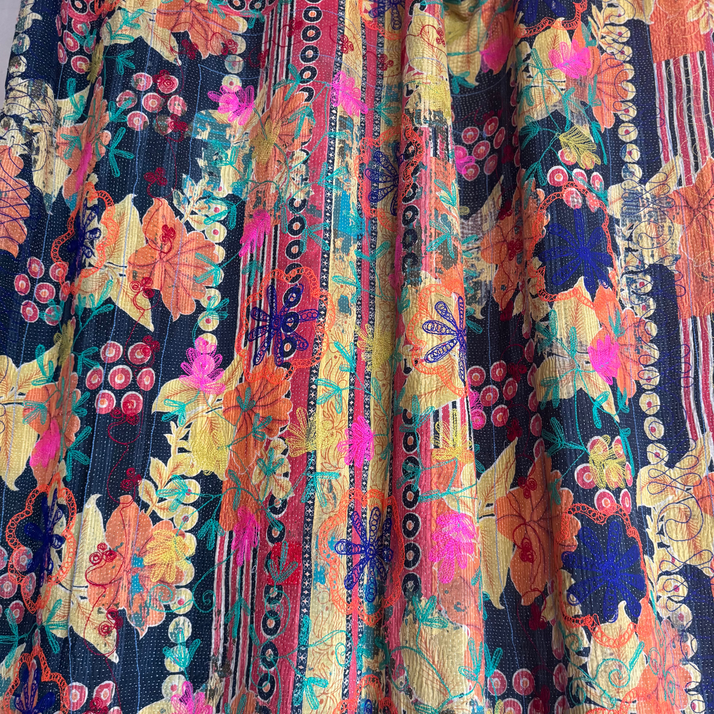 Detail of subtle sari scrap texture revealed by layered running-stitches on Kantha throw