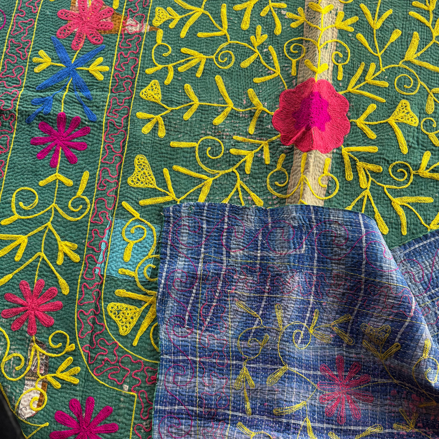Khanta draped to show both grass-green front and blue reverse panels together