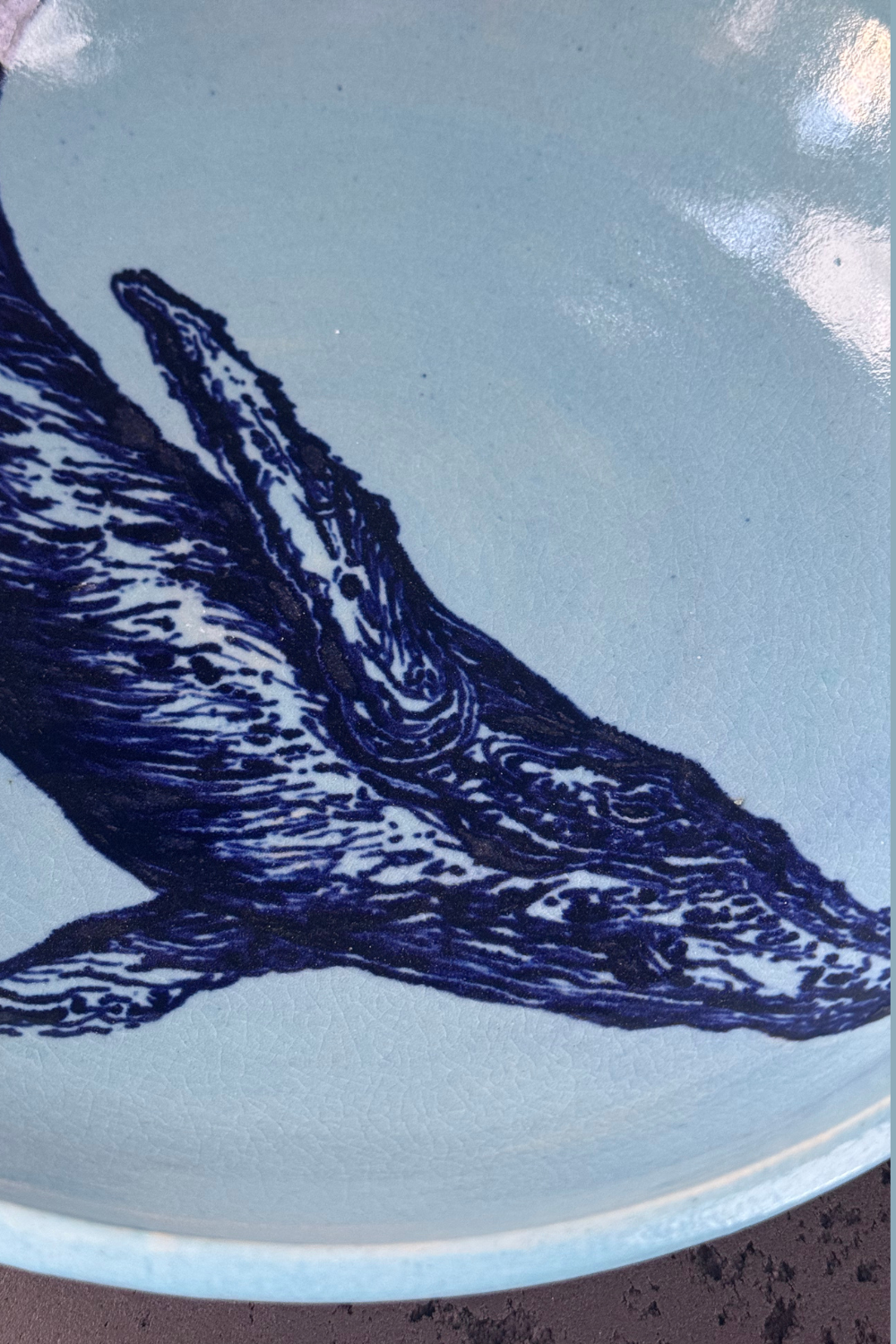 Detailed view of the sculptural tail cut-out on the QM Ceramics whale bowl. Handmade ceramic with a unique artistic design.