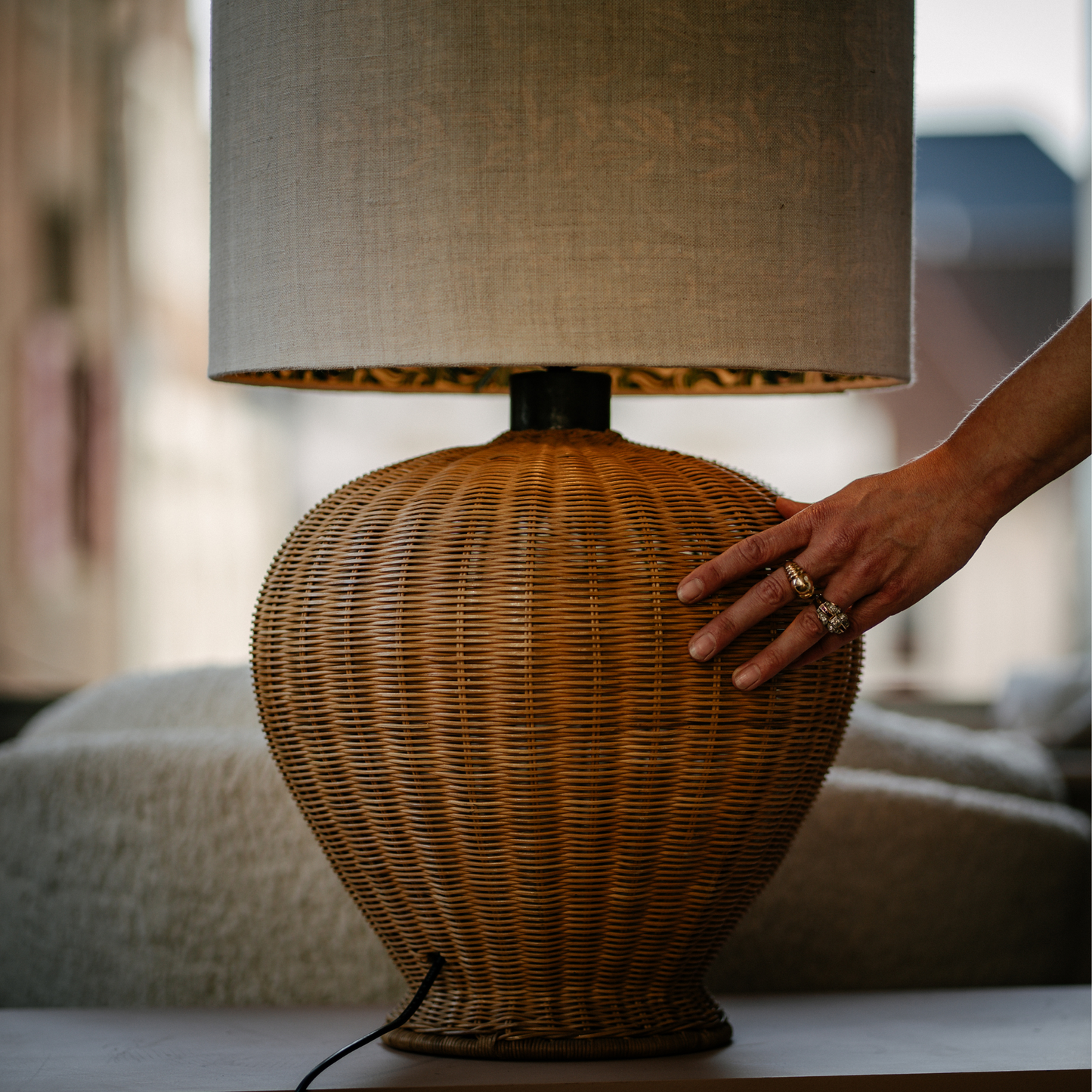 Front view of mid-century French rattan table lamp with bulbous woven base