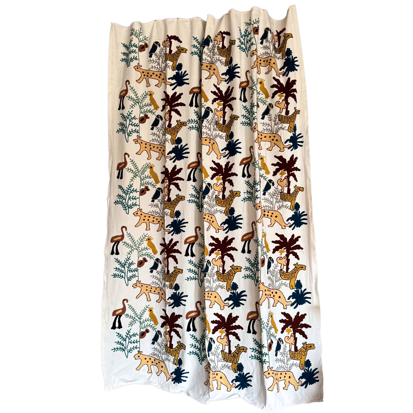 Full front view of white cotton suzani with mustard leopards, navy toucans, rust palms and green ferns