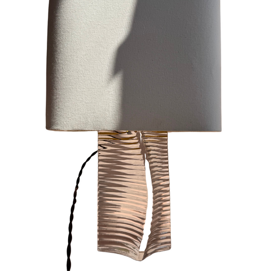 Crystal table lamp with sculpted base and linen shade, signed Daum France