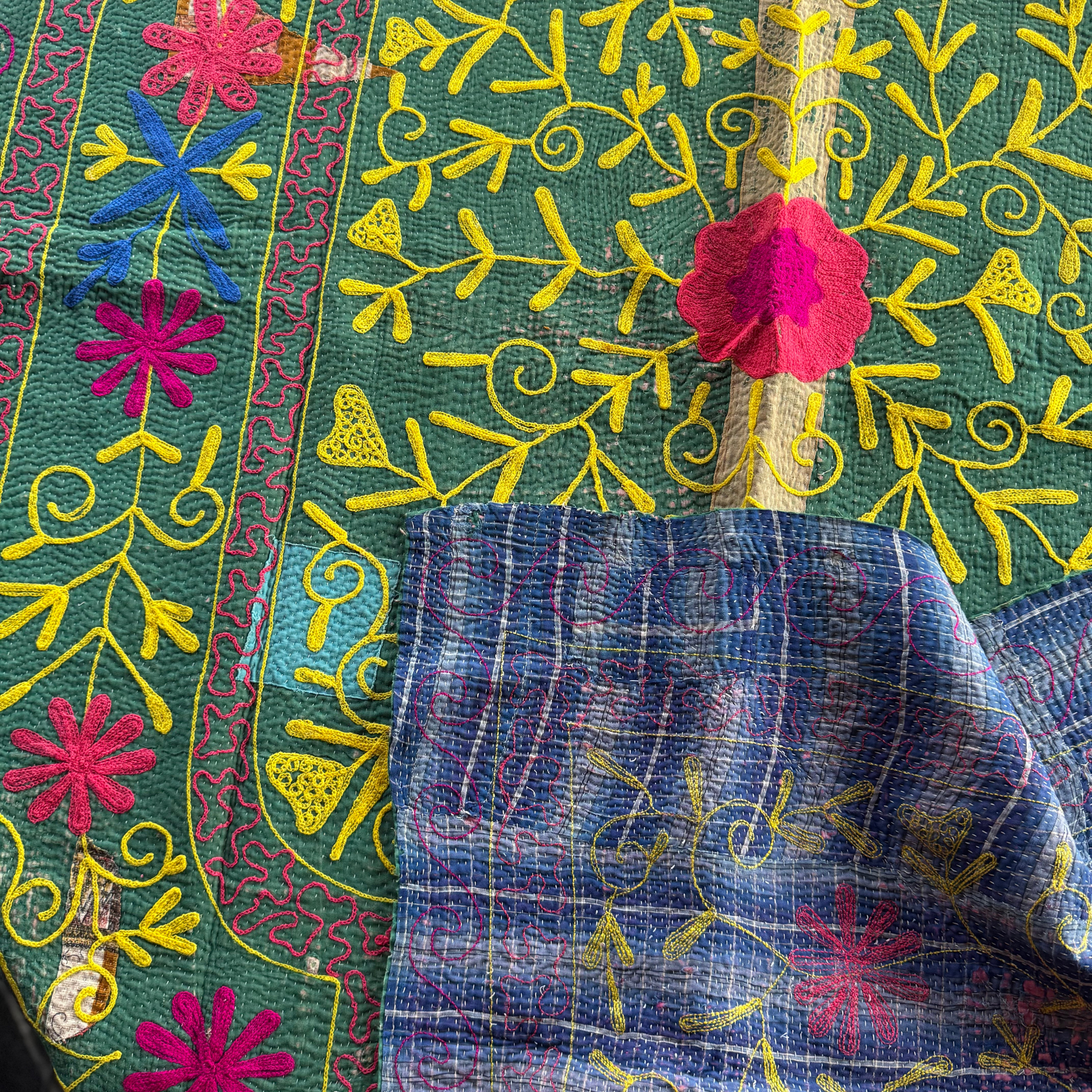 Khanta draped to show both grass-green front and blue reverse panels together