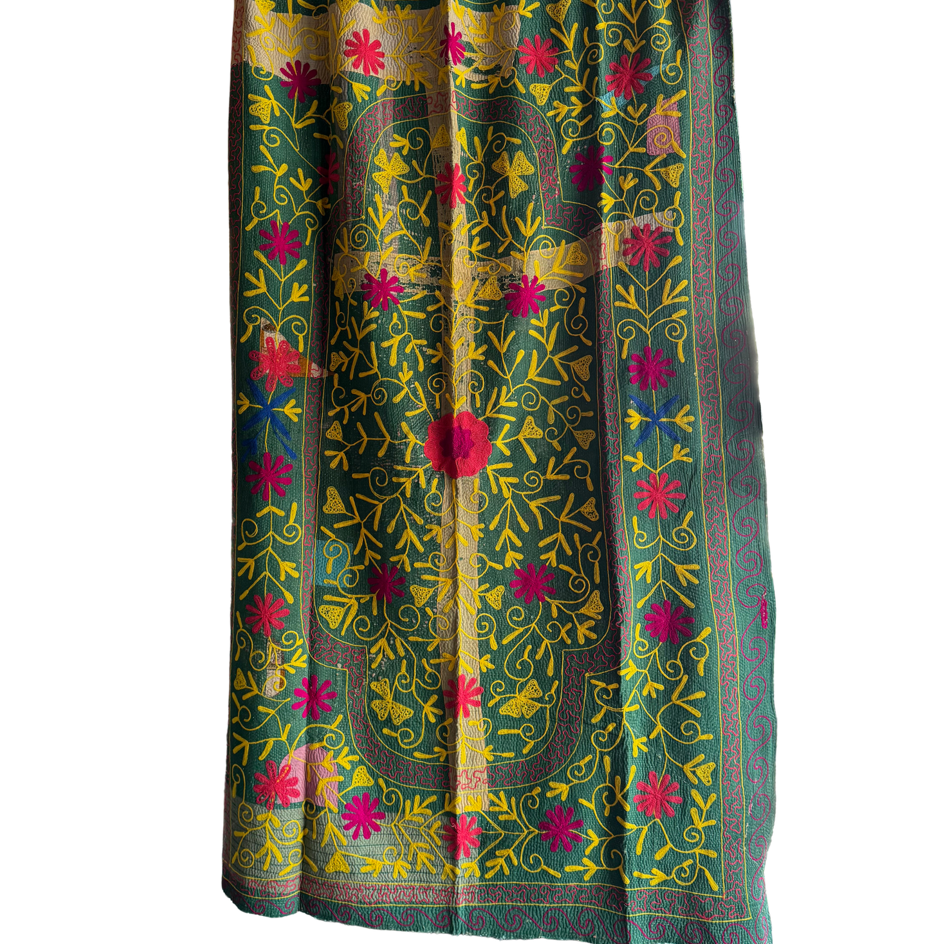 Full view of khanta with grass-green front panel embroidered in yellow and fuchsia florals