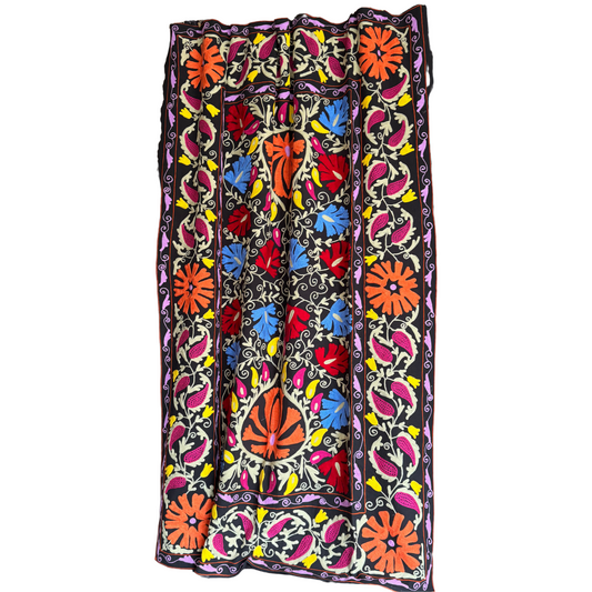 Full front view of one-of-a-kind Suzani textile on black ground with multicolor chain-stitch embroidery