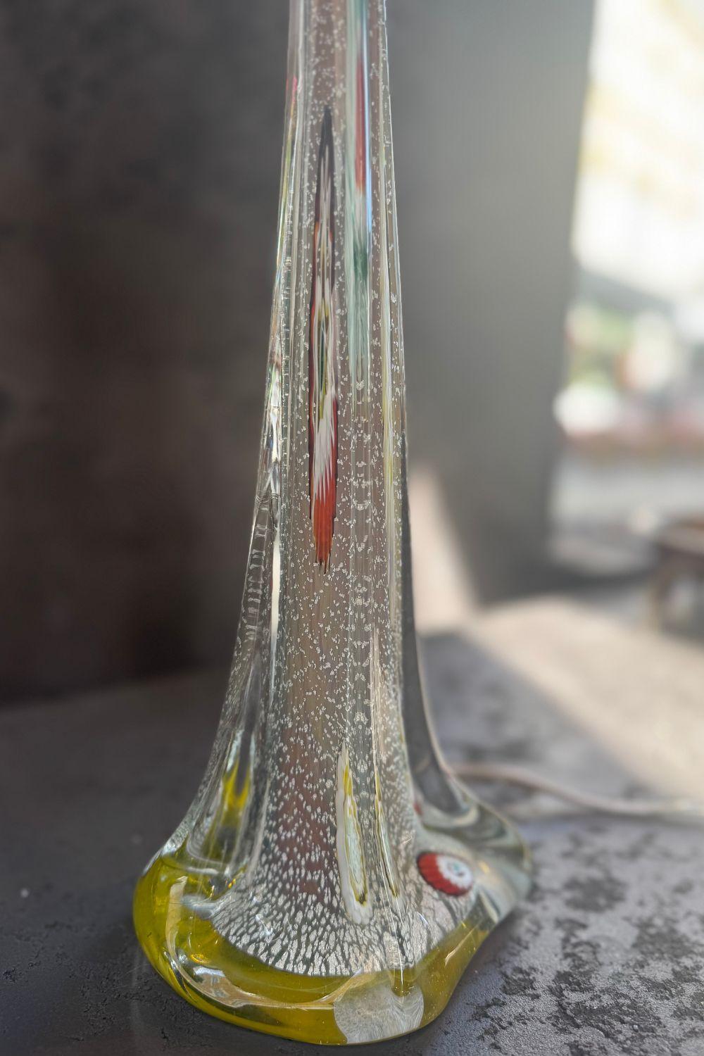 Top view of the glass lamp base with multicolored accents and a smooth, glossy finish.